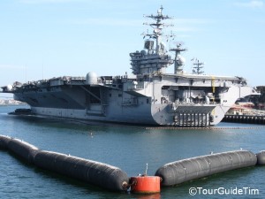 Navy boats and aircraft carriers seen from a Harbor Cruise